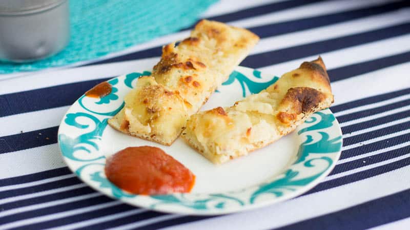 If you're planning on grilling, this is a must-try side you can throw on the top rack. Cheesy Grilled Garlic Bread recipe is savory, simple and delicious!