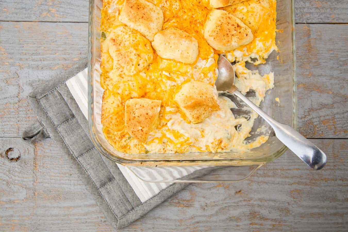 This cheesy chicken pot pie biscuit casserole is SO GOOD. If you’re pinched for time, keep this 30-minute cheesy chicken biscuit casserole simple with ingredients from your pantry. This quick and easy chicken bake uses cream of chicken soup and sour cream, so it is amazingly creamy. *This is a keeper! My kids (and husband!) love it.