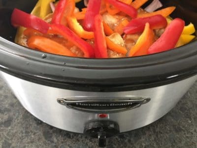Hawaiian Pineapple Crockpot Chicken- Pineapple, peppers and homemade teriyaki sauce make this slow cooker recipe a must-try addition to your meal planning. *My kids devoured this