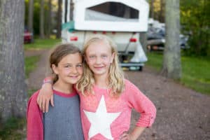 Two girls on a family camping trip