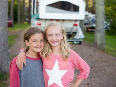 Two girls on a family camping trip