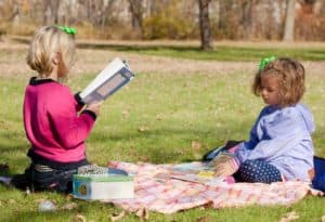 Reading Picnic Party - Pack a blanket and a few snacks, then head to the library to check out some books. Spend the afternoon at a local park reading together.