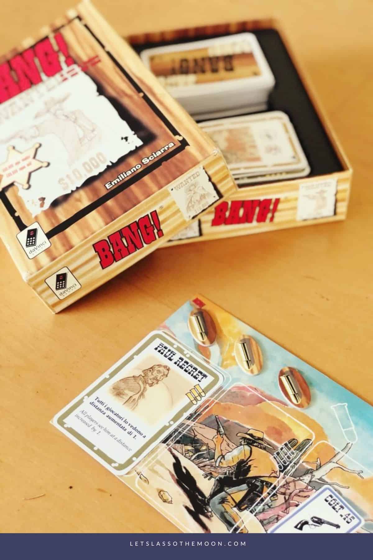 The BANG! card game box open with a few cards and bullet tokens out.