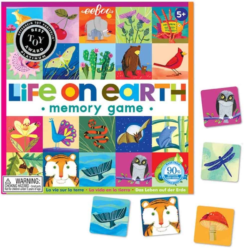 The memory matching game Life on Earth with a few of the tiles outside of the game box.
